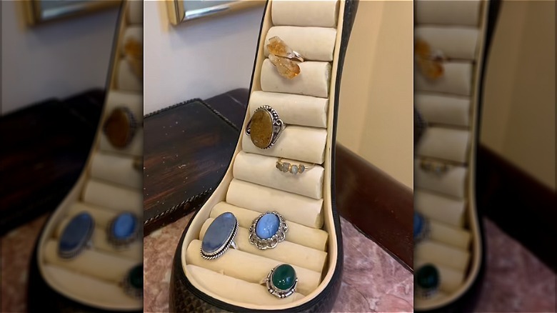 Ring holders in a high-heeled shoe with rings inside