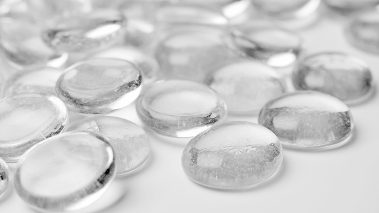 clear glass gems on a white surface