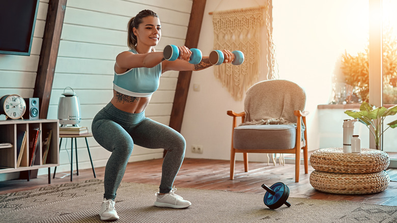 woman using dumbbells