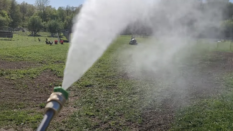 A powerful spray from the unclogged Ryobi pressure washer