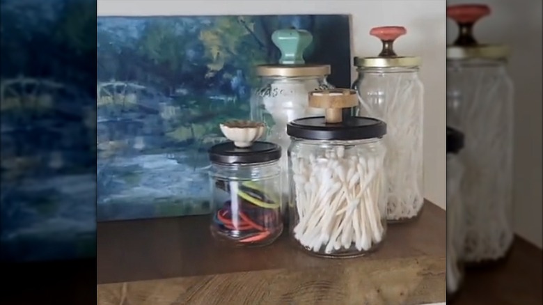 upcycled food jars using door knobs to become storage containers