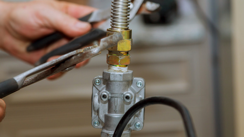 Person repairing gas line