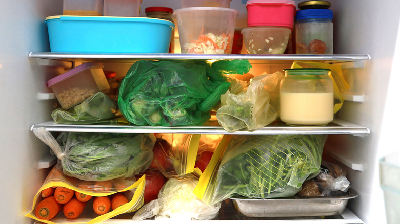 Messy, cluttered fridge