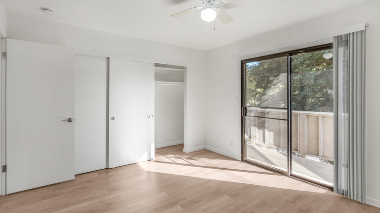 An empty room in a new house with plain sliding glass doors