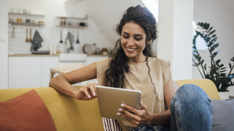 woman shopping on tablet