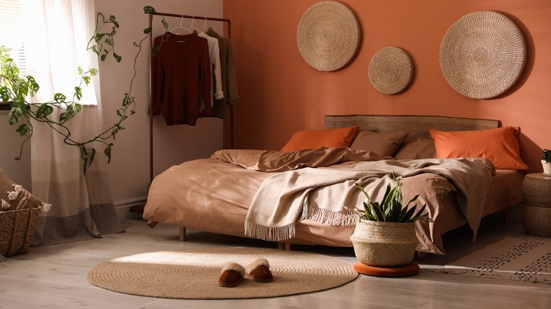 bedroom with orange accent wall