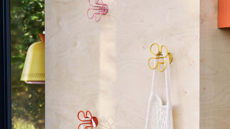 OMMJÄNGE wall hooks holding hangers of clothing