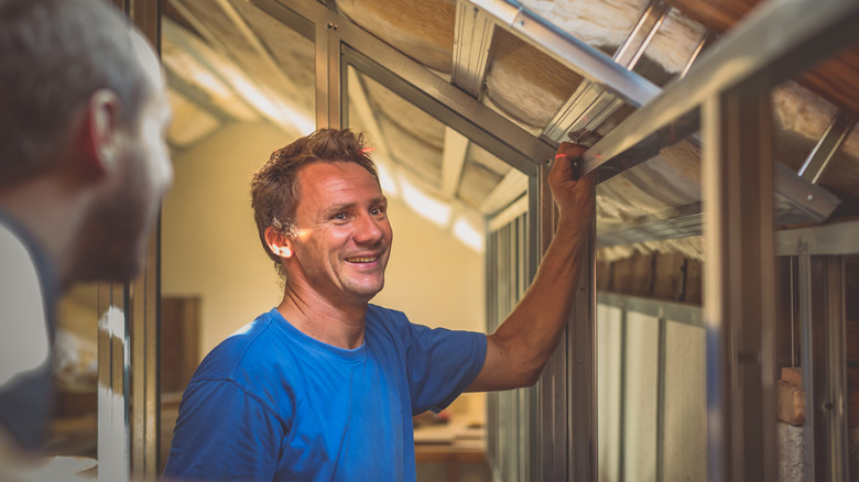 Men working with metal studs