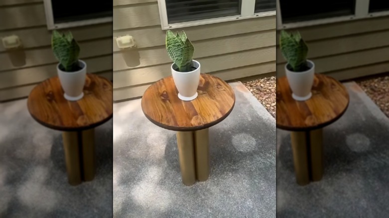 A side table made from PVC pipes and a wood round