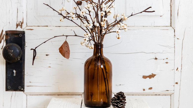 old white door and glass bottle