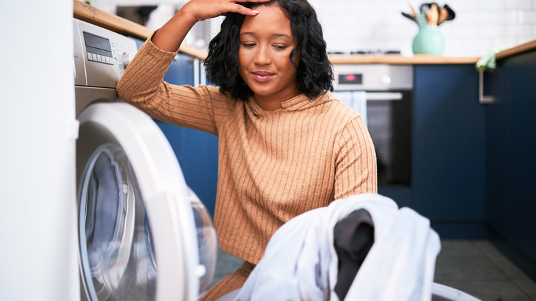 Woman upset washing clothes