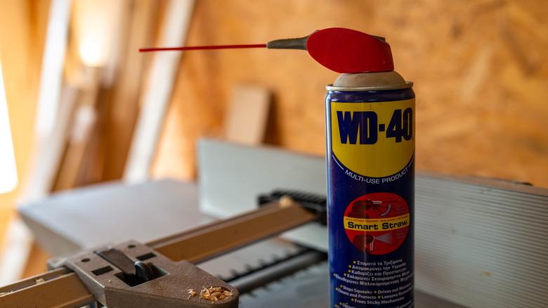 Bottle of WD-40 sitting on work bench
