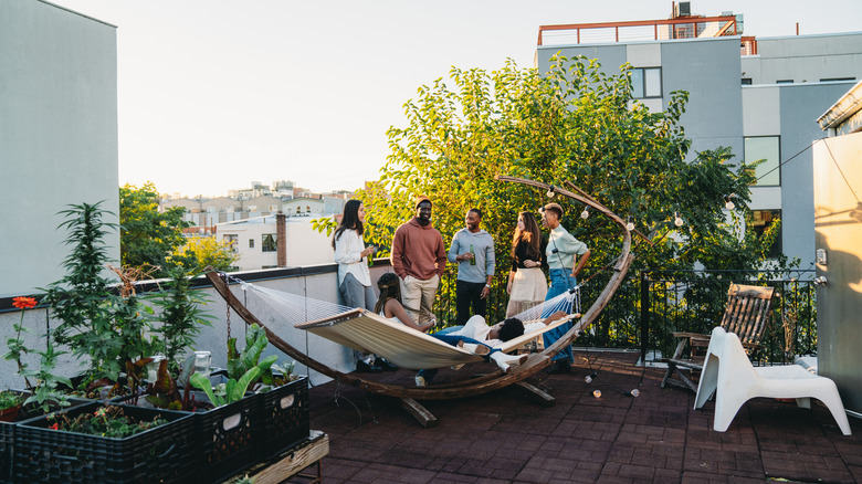 friends hanging out on roof