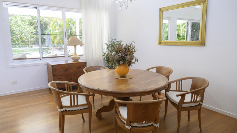 formal dining room with circular fooden table and