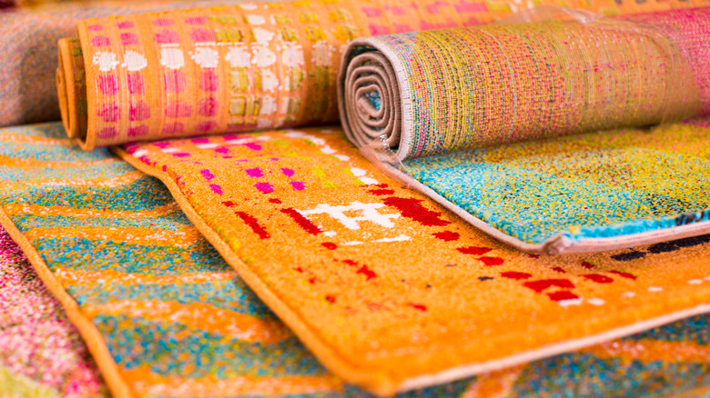 Colorful rolled up wool rugs