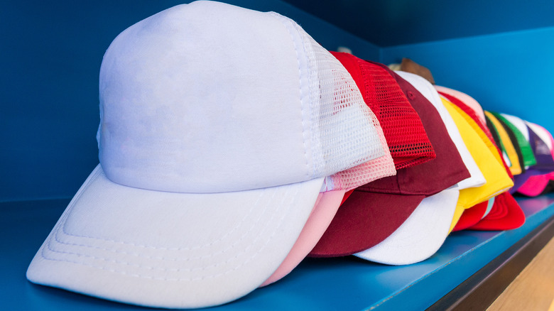 Baseball caps on a shelf