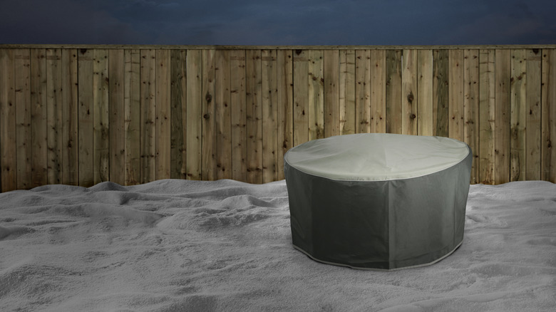 Covered fire pit in snow