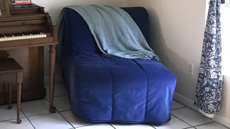 Blue chair in corner
