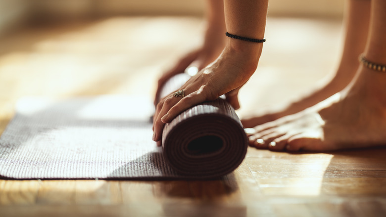 rolling up a yoga mat
