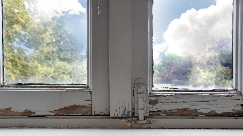 old window with rotting wood