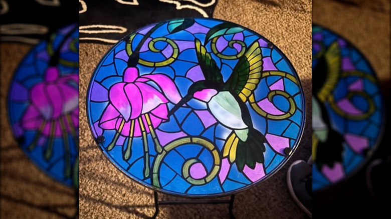 brightly colored glass hummingbird table