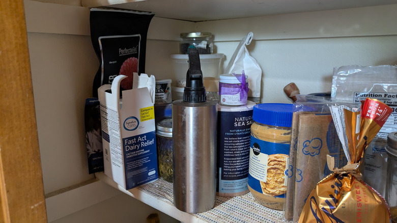 A pantry shelf still needing organization