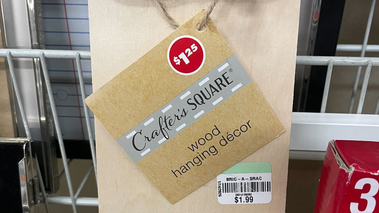 a Goodwill price tag next to a Dollar Tree price tag