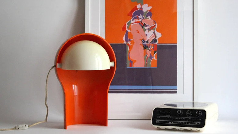 A retro red asymmetrical table light.