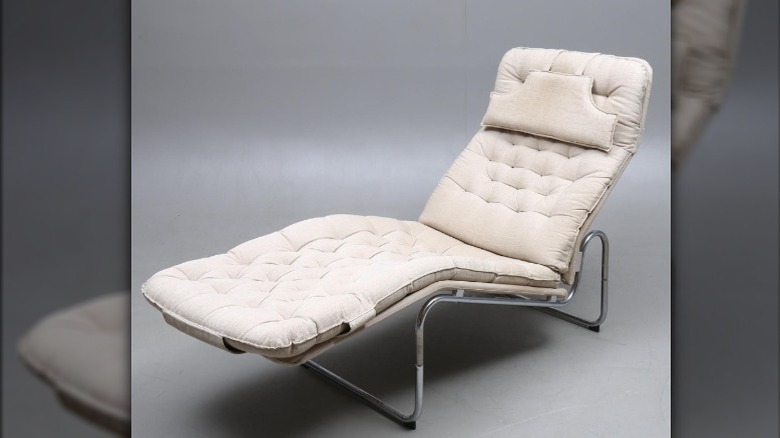 Two mid-century modern lounge chairs.