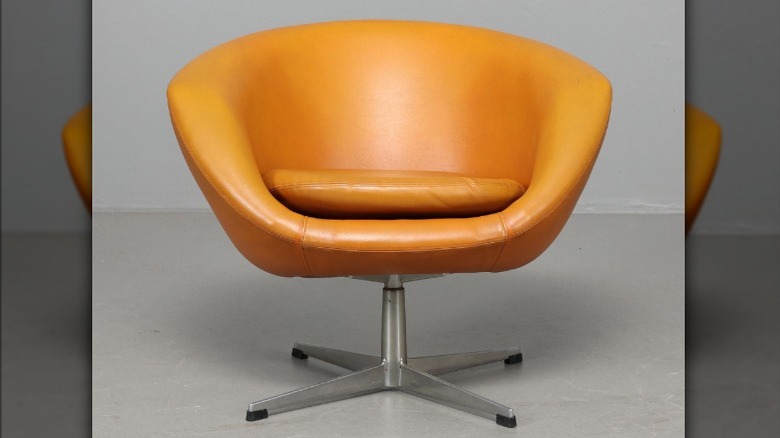 A vintage orange IKEA POLO chair
