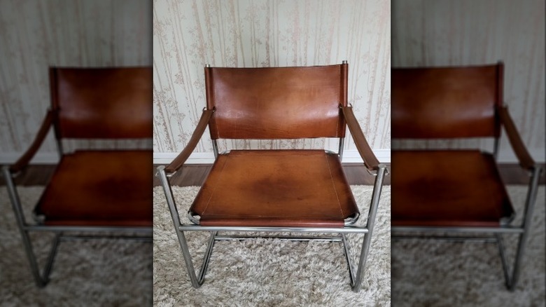 A mid-century leather and chrome arm chair.