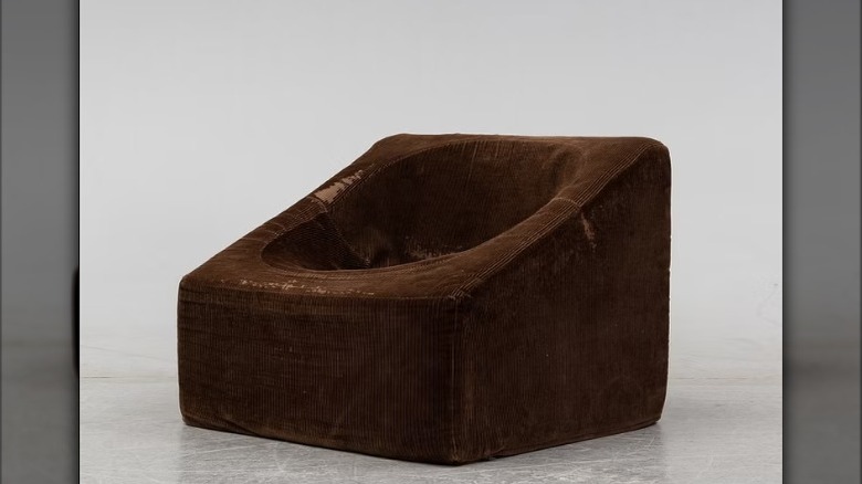 A brown IKEA 'Junior' 'Trofé' chair