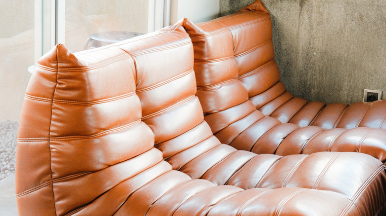 A vintage brown Togo sofa