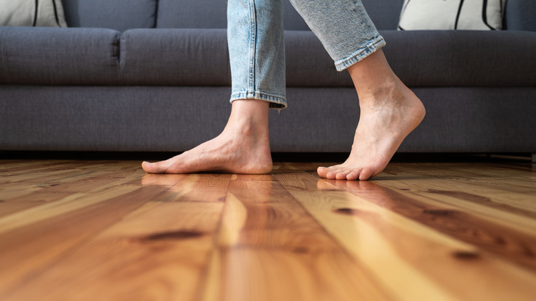 Barefoot on wood floor