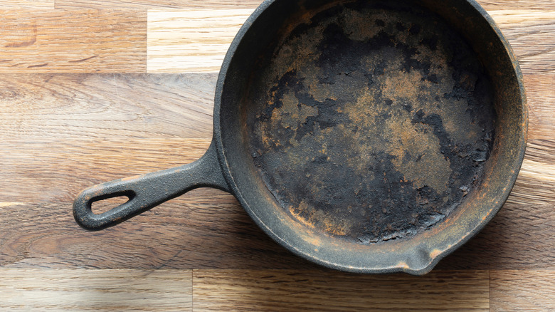 An old frying pan on a counter