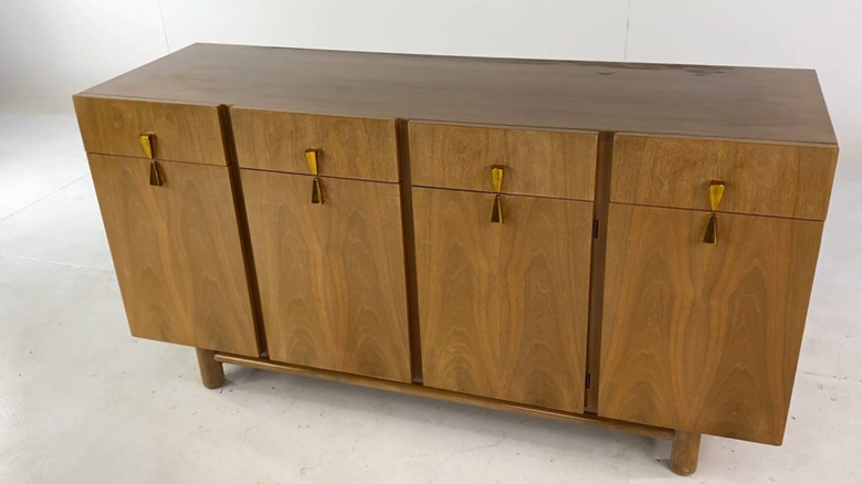 An American of Martinsville midcentury walnut lowboy dresser with brass x pulls.