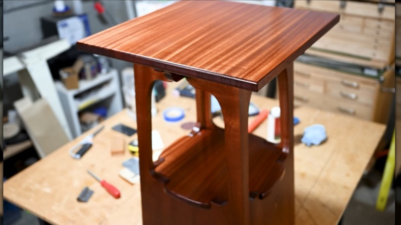 A Limbert-style side table in a word working woodshop.
