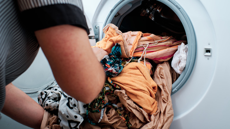 Putting wet clothes in dryer