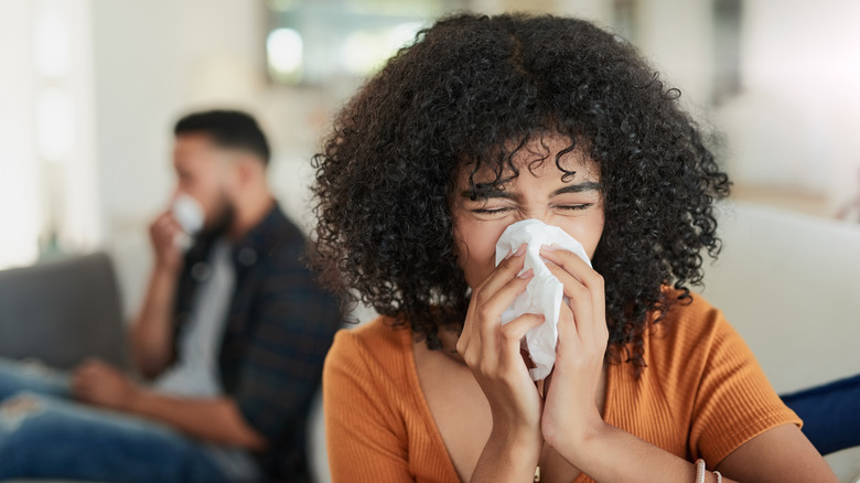 Two people with allergies indoors