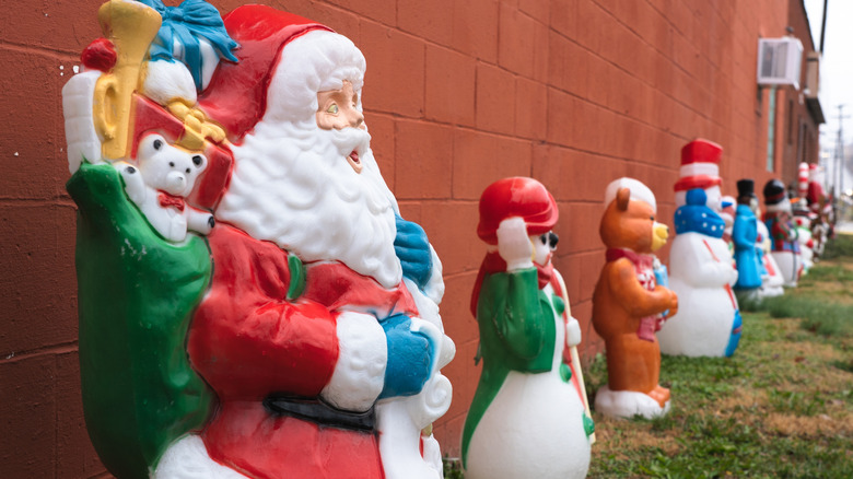 Christmas blow molds along a building