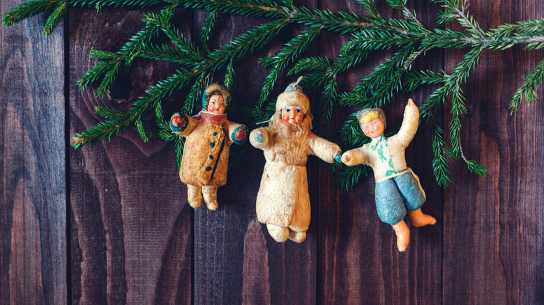 Vintage ornaments hanging on garland