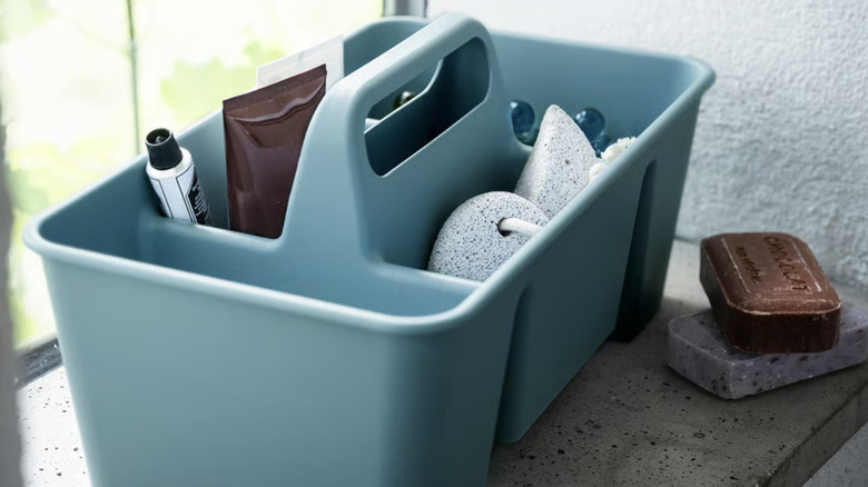 IKEA organizer caddy with pumice stone, soaps, and other bathroom supplies