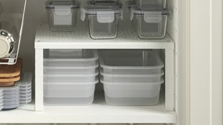 IKEA VARIERA shelf insert being used to organize kitchen storage tools