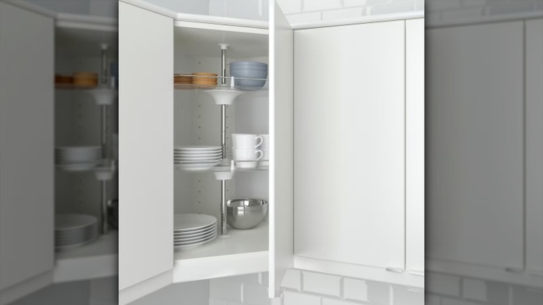 rotating cabinet with dishware