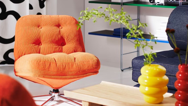 Orange cushioned upholstered swivel chair