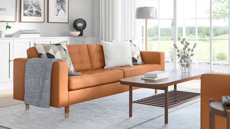 Golden brown sofa with wood legs