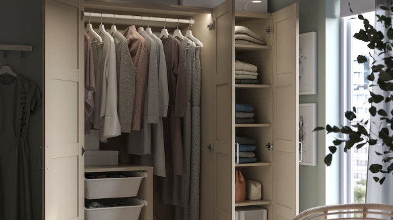Beige wardrobe with doors and organizer inserts