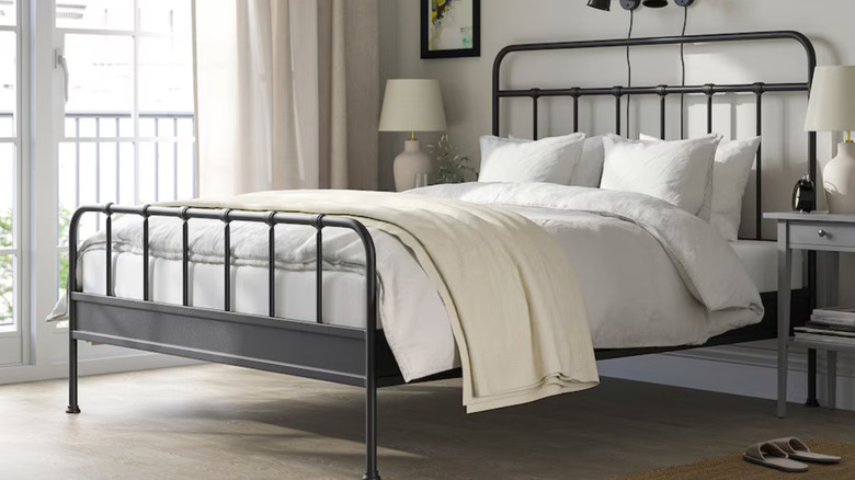 Black steel bed frame with slatted headboard