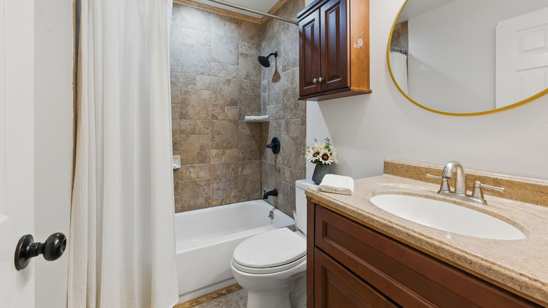 A small but modern, tiled bathroom