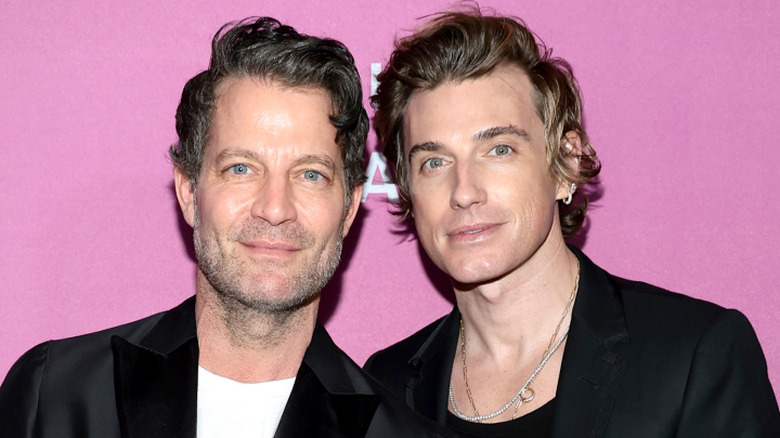 Nate Berkus and Jeremiah Brent with a pink background.